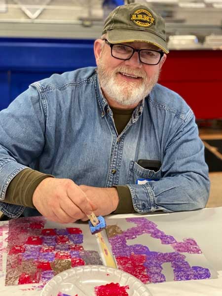 Veterans and families during workshops creating art for Yellow Ribbon installation